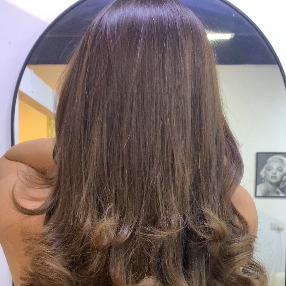 Curled hair styling result at Azema hair salon JVC