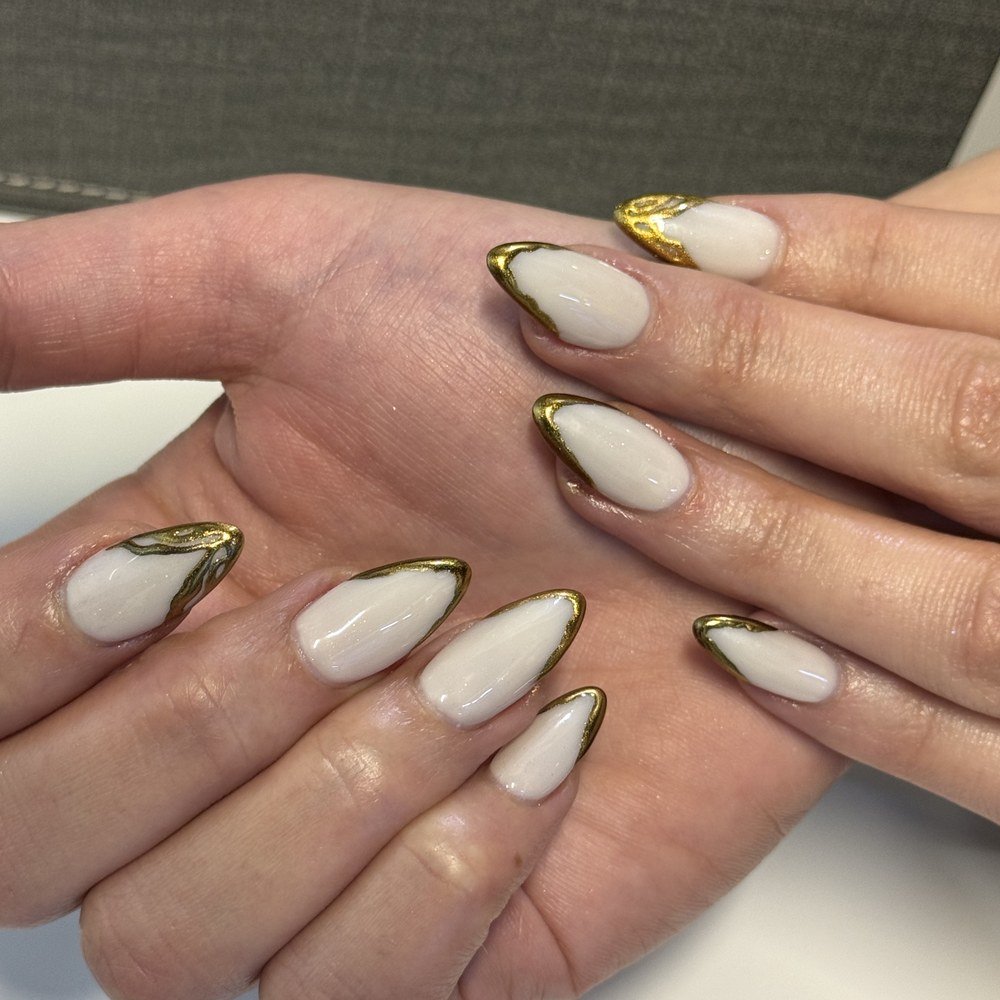 White and gold nail design at Azema nail salon JVC